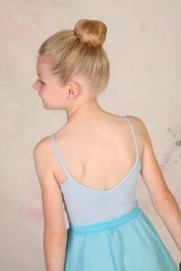 Young ballet girl with ballet bun hairstyle