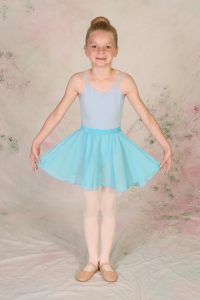 young girl in dress code for ballet and tap